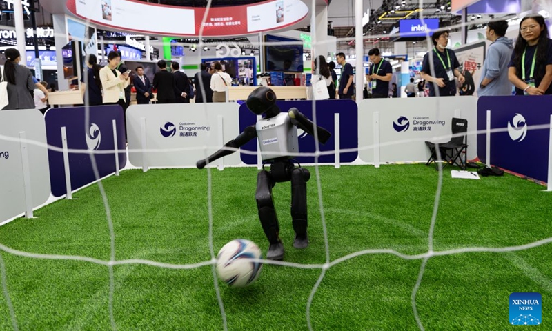A robot plays soccer in the digital technology exhibition area of the 4th China International Supply Chain Expo (CISCE) held in Beijing, the capital of China, on June 23, 2026. The 4th CISCE will be held in Beijing from June 22nd to 26th. CISCE, which opens in 2023, is the world's first national-level exhibition focused on supply chains. Now in its fourth year, CISCE maintains a panoramic view of the industry chain, featuring six major chain and supply chain service exhibition areas. For the first time, the Digital Technology section also introduces a zone dedicated to Artificial Intelligence. (Photo: Xinhua)