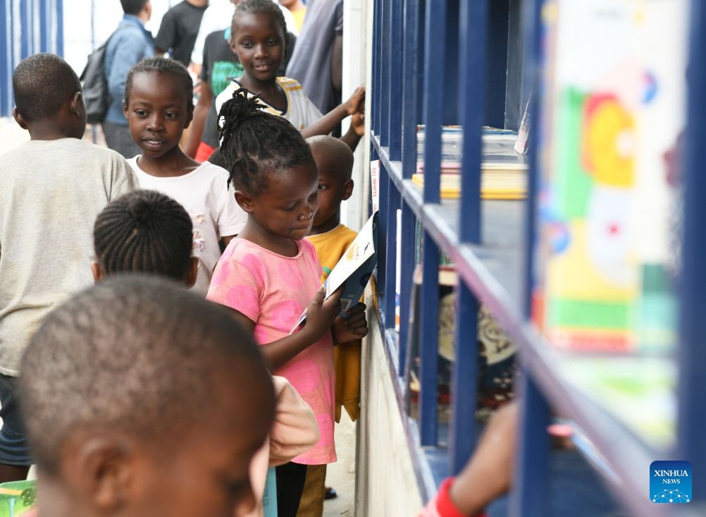 Children read books inside the Amani Kibera Book House in the Kibera slum of Nairobi, the capital of Kenya, on June 23, 2026. A completion ceremony for the Amani Kibera Book House, a public welfare library designed by an architectural research team from the Chinese University of Hong Kong, was held in Nairobi on Tuesday. (Photo: Xinhua)