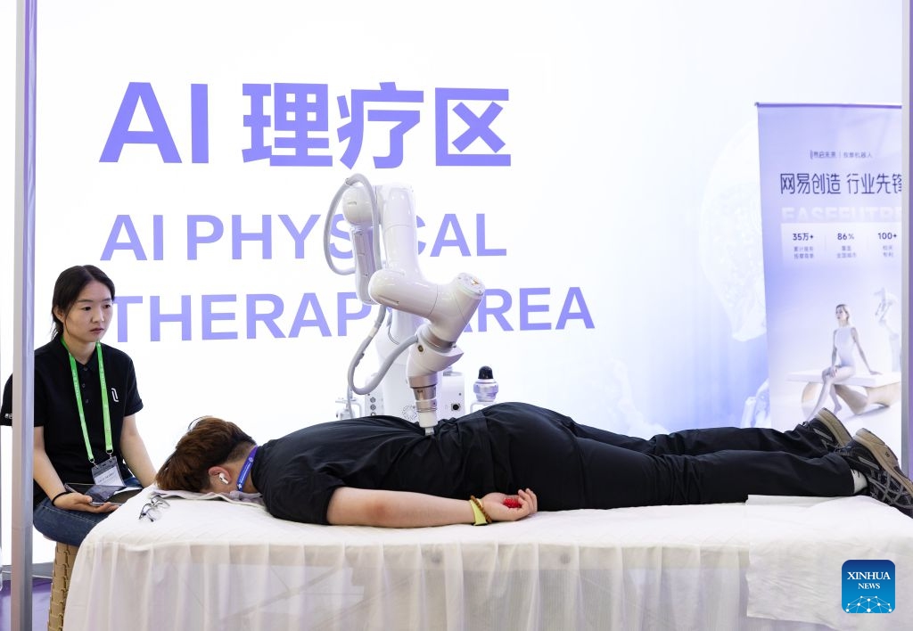 Visitors experience AI physical therapy at the digital technology exhibition area of the 4th China International Supply Chain Expo (CISCE) held in Beijing, the capital of China, on June 23, 2026. The 4th CISCE will be held in Beijing from June 22nd to 26th. CISCE, which opens in 2023, is the world's first national-level exhibition focused on supply chains. Now in its fourth year, CISCE maintains a panoramic view of the industry chain, featuring six major chain and supply chain service exhibition areas. For the first time, the Digital Technology section also introduces a zone dedicated to Artificial Intelligence. (Photo: Xinhua)