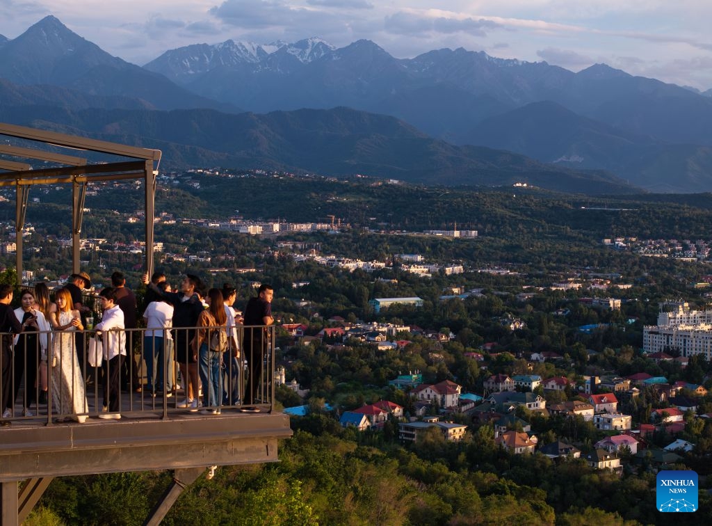 A drone photo taken on June 22, 2026 shows visitors on the Koktobe Mountain in Almaty, Kazakhstan. (Photo: Xinhua)