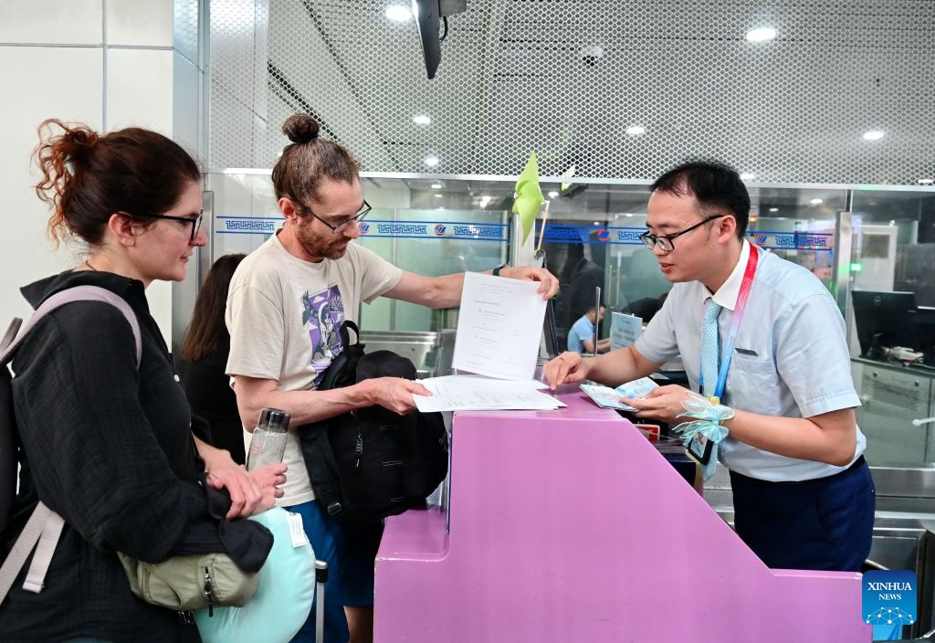 Passengers check in at the Xiamen Airlines counters to board the first direct flight from Fuzhou to Amsterdam at the Fuzhou Changle International Airport in Fuzhou, southeast China's Fujian Province, June 23, 2026. A direct flight route linking Fuzhou, capital city of southeast China's Fujian Province with Amsterdam, the capital of the Netherlands, was launched on Tuesday. The route is operated by Xiamen Airlines, offering two flights every week. (Photo: Xinhua)