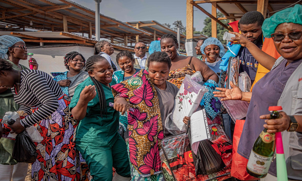 Healthcare workers celebrate with survivors of Ebola as they leave hospital after being declared cured, in Ituri, Democratic Republic of the Congo, on June 23, 2026. The global risk posed by the ongoing Ebola outbreak in Africa remains low, despite rising case numbers in the affected region, World Health Organization Director-General Tedros Adhanom Ghebreyesus said on Wednesday, according to Xinhua. Photo: VCG