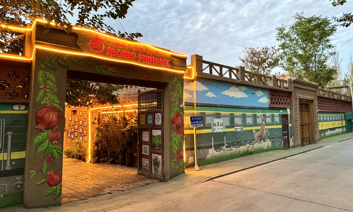 The photo taken on June 20 shows a local home adorned with vibrant graffiti in Ximen village, Xinjiang. Photo: Courtesy of the author