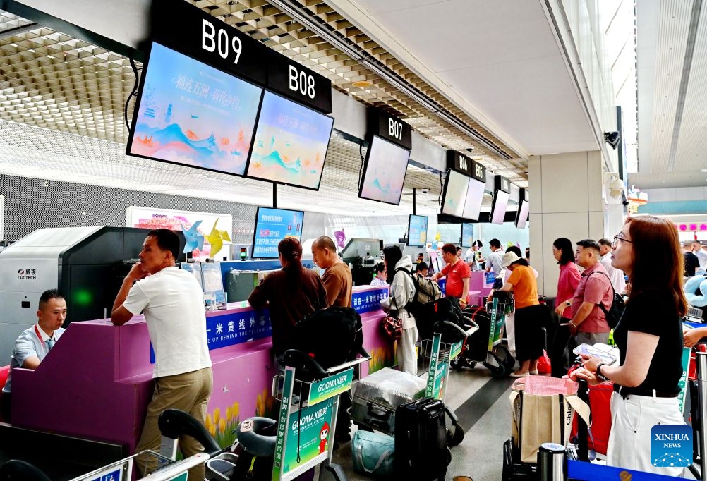 Passengers check in at the Xiamen Airlines counters to board the first direct flight from Fuzhou to Amsterdam at the Fuzhou Changle International Airport in Fuzhou, southeast China's Fujian Province, June 23, 2026. A direct flight route linking Fuzhou, capital city of southeast China's Fujian Province with Amsterdam, the capital of the Netherlands, was launched on Tuesday. The route is operated by Xiamen Airlines, offering two flights every week. (Photo: Xinhua)