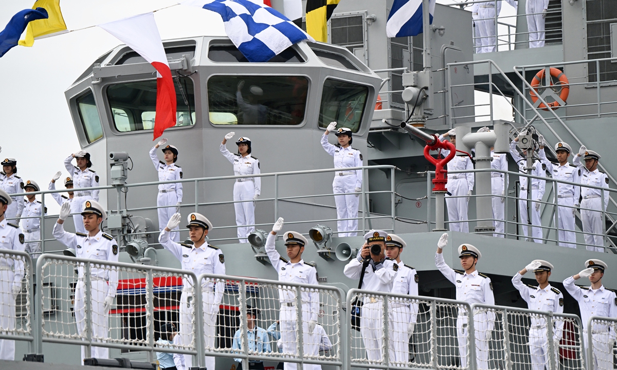 Crew members of the Qi Jiguang training ship of the Chinese People's Liberation Army Navy stand on deck upon arrival on a business call in the port city of Vladivostok, Russia, on June 23, 2026. Photo: VCG