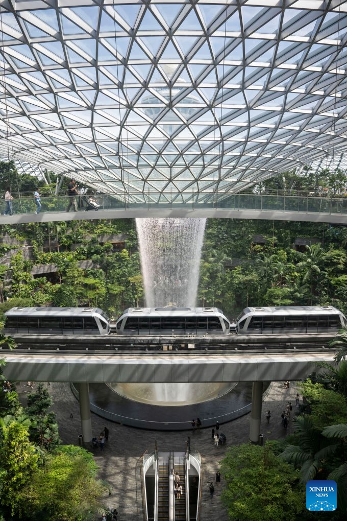 This photo taken on June 23, 2026 shows a view of the indoor man-made waterfall Rain Vortex at Jewel Changi Airport in Singapore. (Photo: Xinhua)