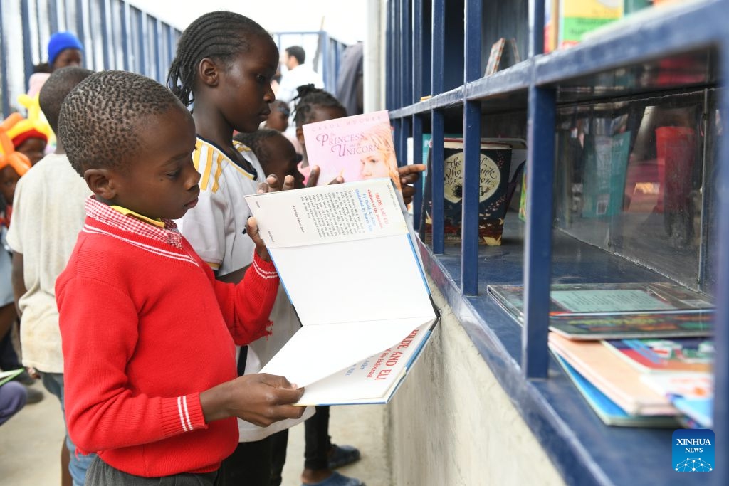 Children read books inside the Amani Kibera Book House in the Kibera slum of Nairobi, the capital of Kenya, on June 23, 2026. A completion ceremony for the Amani Kibera Book House, a public welfare library designed by an architectural research team from the Chinese University of Hong Kong, was held in Nairobi on Tuesday. (Photo: Xinhua)