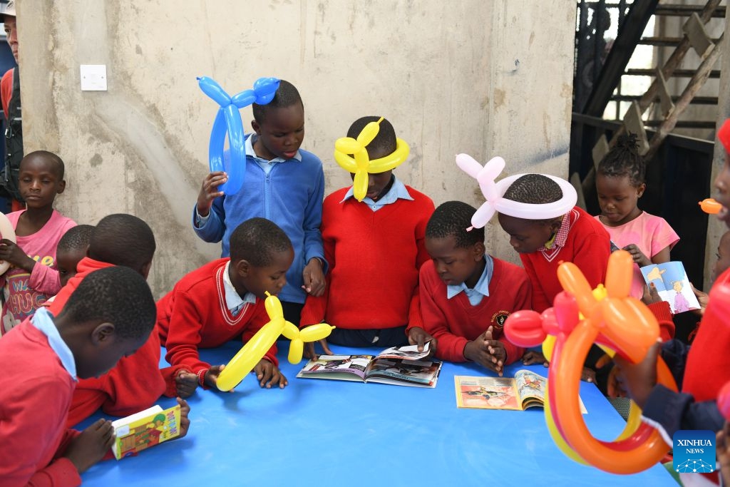 Children read books inside the Amani Kibera Book House in the Kibera slum of Nairobi, the capital of Kenya, on June 23, 2026. A completion ceremony for the Amani Kibera Book House, a public welfare library designed by an architectural research team from the Chinese University of Hong Kong, was held in Nairobi on Tuesday. (Photo: Xinhua)