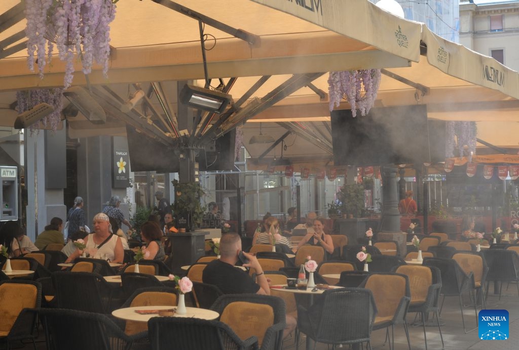 People cool off under the sunshade at a restaurant amid a heatwave in Zagreb, Croatia, June 24, 2026. (Photo: Xinhua)