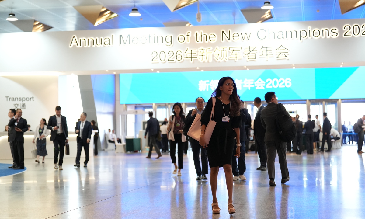 Participants walk inside the venue of the World Economic Forum's 17th Annual Meeting of the New Champions, also known as the Summer Davos forum, in Dalian, Northeast China's Liaoning Province, on June 23, 2026. Photo: VCG