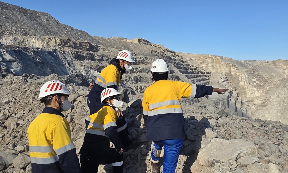 Namibian and Chinese staff members conduct exploration and testing together at the mine site in Namibia. Photo: Courtesy of CNUC
