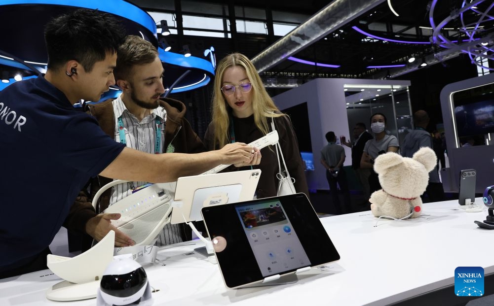 A visitor plays a smart guitar during the 2026 Mobile World Congress (MWC) Shanghai in Shanghai, east China, June 24, 2026. MWC Shanghai, slated for June 24 to 26 this year, is Asia's largest and most influential connectivity ecosystem event, with global leaders and innovators set share their visions for the future of connectivity at this showpiece in east China. (Photo: Xinhua)