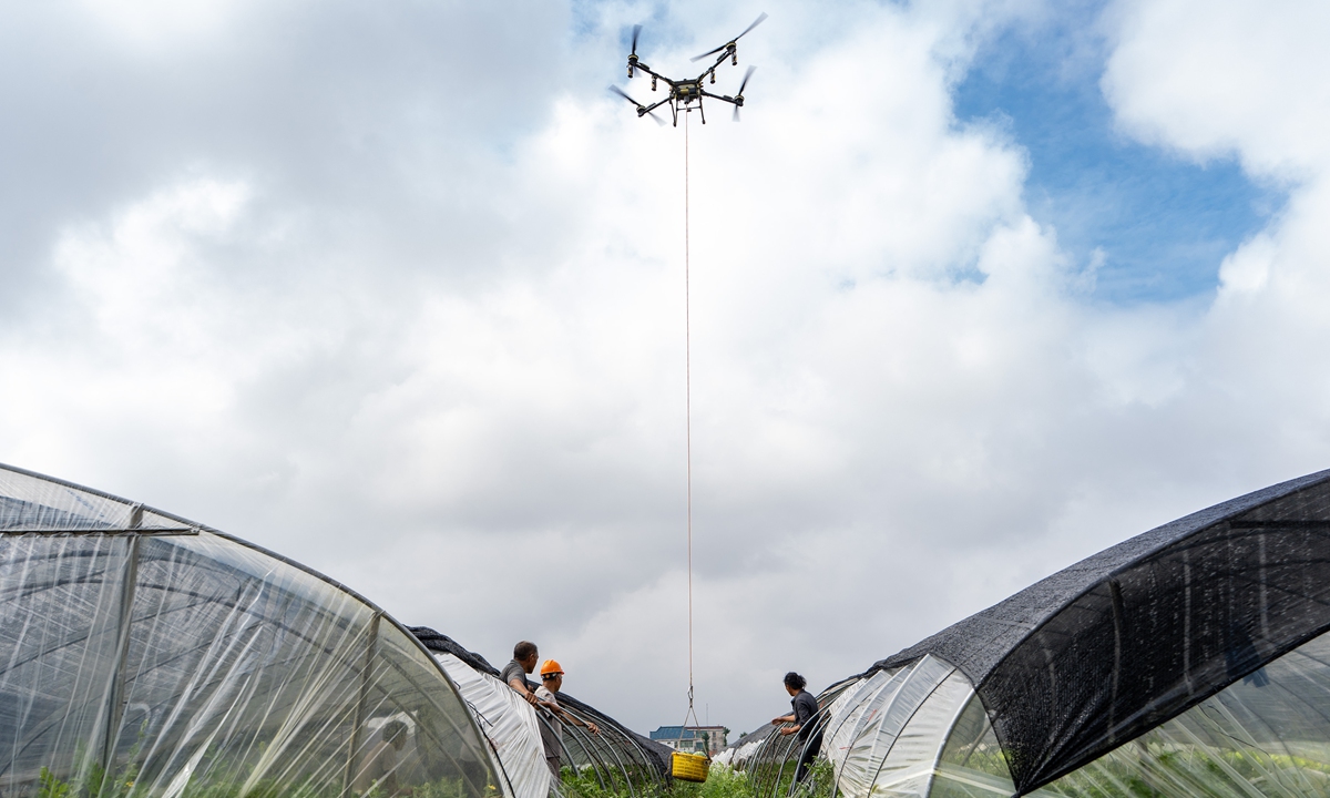Farmers use drones to transport freshly harvested watermelons from their greenhouses in Shizong Township, Nantong, East China's Jiangsu Province, on June 25, 2026. In recent years, Shizong has guided the local melon and vegetable industry toward eco-friendly, standardized, and light-mechanized operations, empowering field harvesting with smart equipment and helping farmers achieve high yields and increased incomes. Photo: CNS Photo