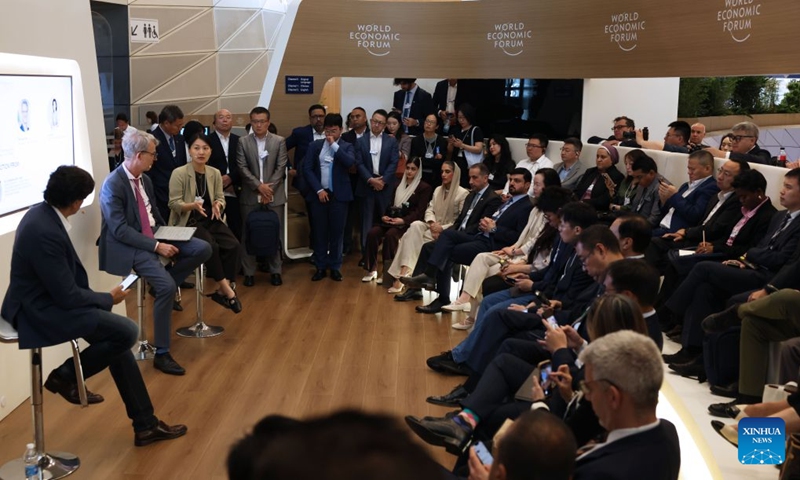 Participants attend a session titled When AI Agents Cross the Border during the 17th Annual Meeting of the New Champions, also known as the Summer Davos, at the Dalian International Conference Center in Dalian, northeast China's Liaoning Province, June 24, 2026. Featuring the theme Innovating at Scale, the event is held from June 23 to 25. Over 30 subjects related to artificial intelligence and robotics are among the hot topics at this year's forum. (Photo: Xinhua)