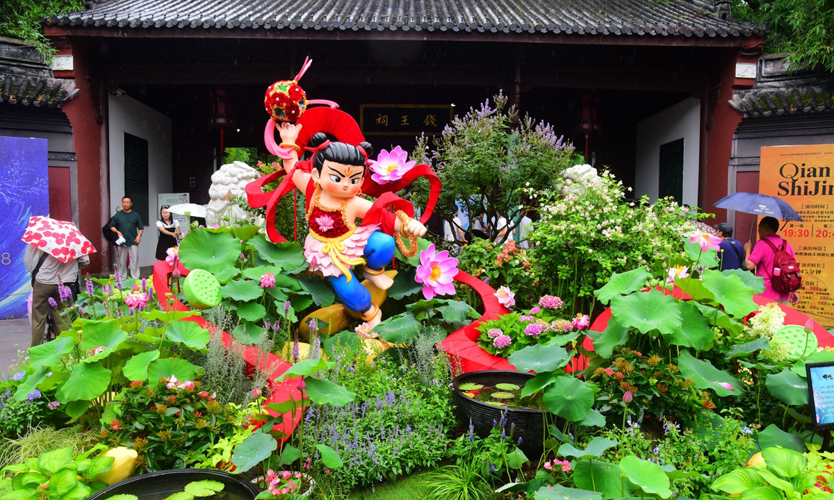 Residents and visitors are seen visiting and photographing the third West Lake Lotus Exhibition at Qianwang Temple in Hangzhou, East China's Zhejiang Province, on June 24, 2026. Photo: VCG