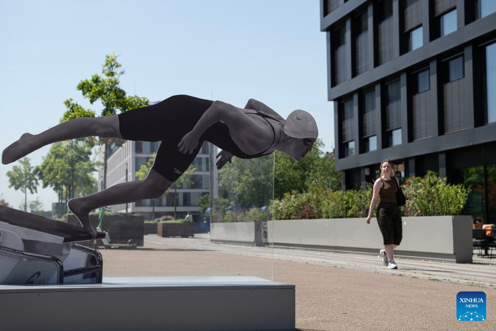A woman walks in the sunshine in Duisburg, Germany, June 24, 2026. Germany has been experiencing a heatwave in recent days, with temperatures approaching 40 degrees Celsius in some regions. (Photo: Xinhua)