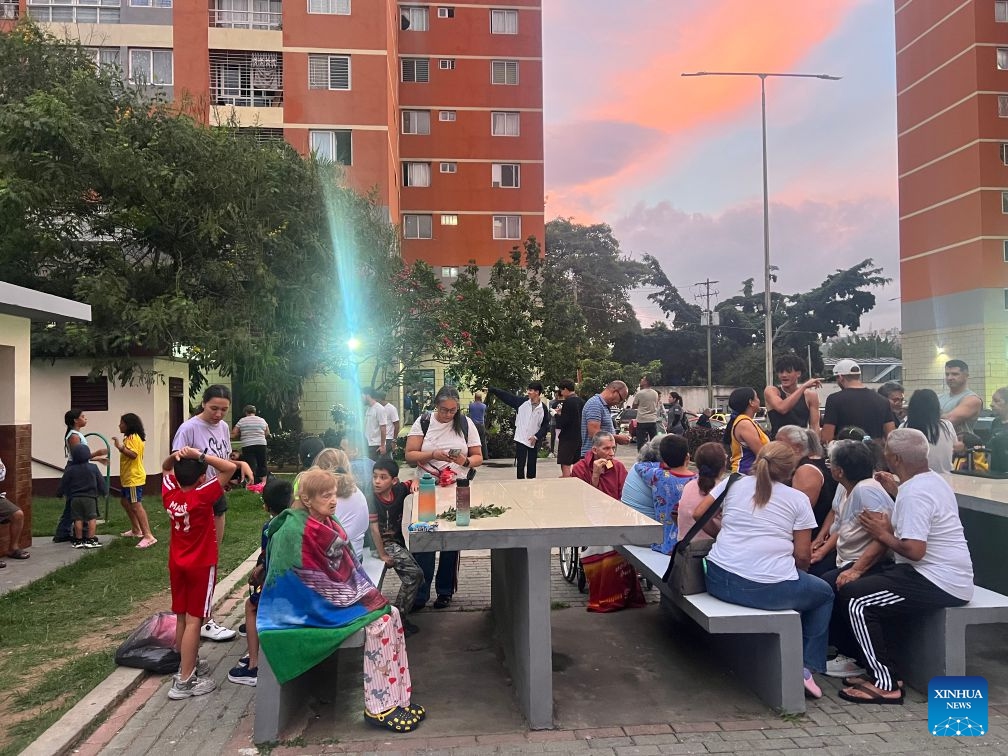 This photo taken with a mobile phone shows people gathering in an open space after an earthquake in Caracas, Venezuela, June 24, 2026. Two powerful earthquakes, striking in rapid succession, hit Venezuela on Wednesday, causing buildings to collapse in the capital of Caracas. The U.S. Geological Survey (USGS) reported a magnitude 7.1 quake, followed just one minute later by an even stronger 7.5-magnitude tremor, with both hitting near the coastal town of Moron, about 160 km west of Caracas. (Photo: Xinhua)