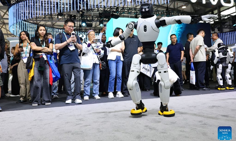 Visitors watch a robot dancing during the 2026 Mobile World Congress (MWC) Shanghai in Shanghai, east China, June 24, 2026. MWC Shanghai, slated for June 24 to 26 this year, is Asia's largest and most influential connectivity ecosystem event, with global leaders and innovators set share their visions for the future of connectivity at this showpiece in east China. (Photo: Xinhua)