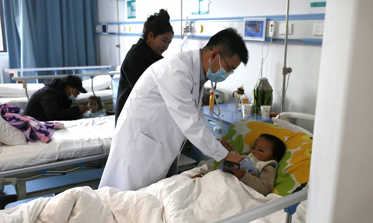 A pediatrician from Guangdong Province sees a child at Nyingchi People's Hospital in Nyingchi, Xizang, in May 2026. Photo: Shan Jie/GT