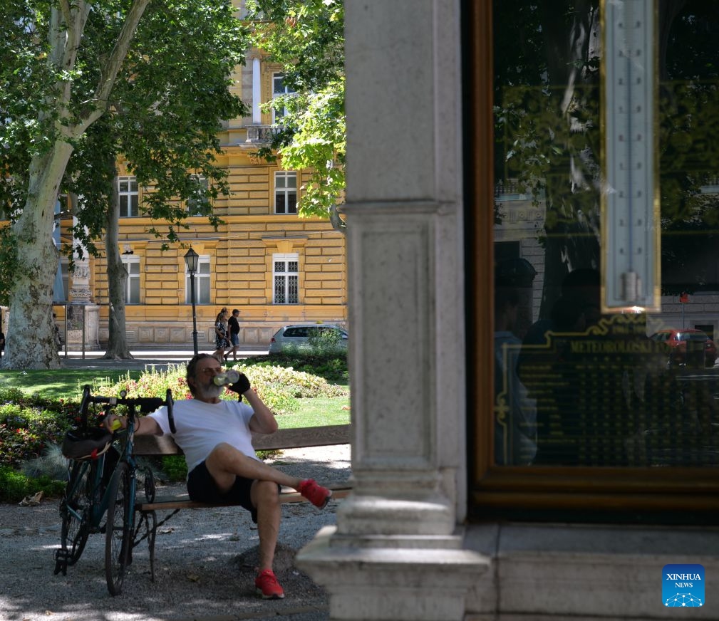 A man drinks water on a park bench amid a heatwave in Zagreb, Croatia, June 25, 2026. Croatia has been experiencing a heatwave for several days, with some areas seeing temperatures exceeding 35 degrees Celsius. (Xinhua/Ma Zhen)