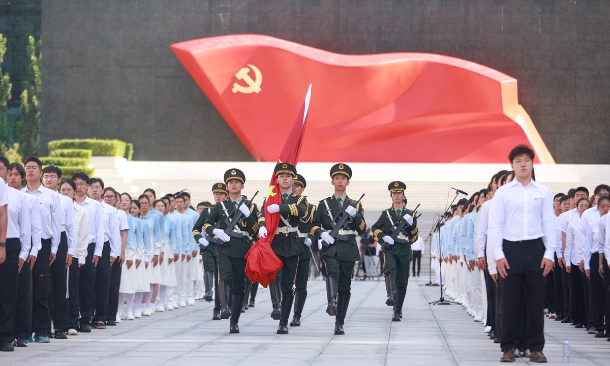 On July 26, a student national flag guard marches at the Museum of the Communist Party of China, Beijing, during an oath-taking event marking the upcoming 105th anniversary of the CPC, which falls on July 1. Nearly 1,000 young participants joined the activity. Photo: VCG