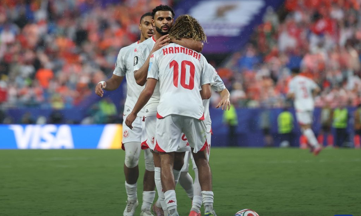 Hannibal Mejbri (front) of Tunisia interacts with teammates during the group F match between the Netherlands and Tunisia at the 2026 FIFA World Cup at Kansas City Stadium in Kansas City, the United States, June 25, 2026. (Xinhua/Li Ying)
