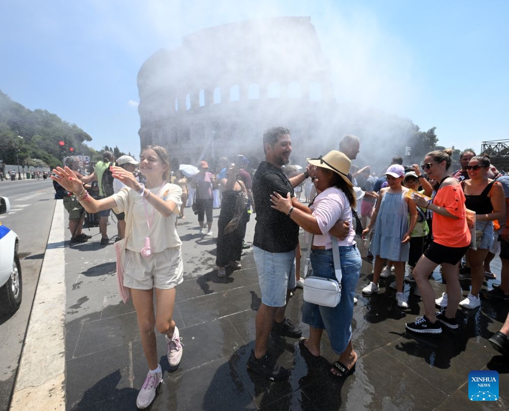 People cool off near a misting equipment near the Colosseum amid a heatwave in Rome, Italy, June 26, 2026. (Photo: Xinhua)