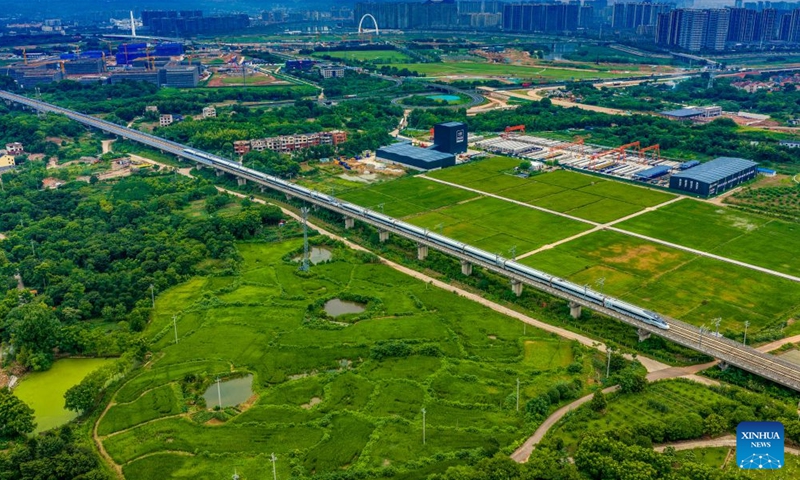 An aerial drone photo taken on June 27, 2026 shows a high-speed railway train running on the Hangzhou-Taizhou high-speed railway in Shengzhou, east China's Zhejiang Province. (Xinhua)

