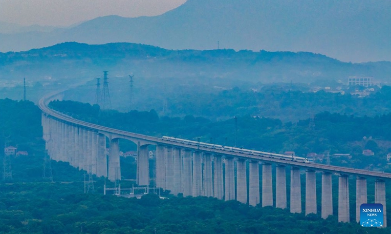 An aerial drone photo taken on June 27, 2026 shows a high-speed railway train running on the Hangzhou-Taizhou high-speed railway in Shengzhou, east China's Zhejiang Province. 