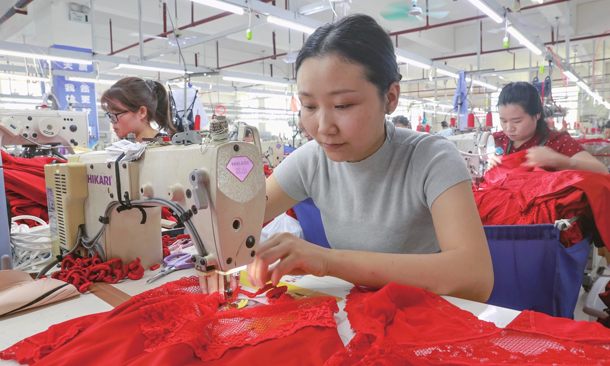 Employees work at a textile manufacturing workshop in Qiandongnan Miao and Dong Autonomous Prefecture, Southwest China's Guizhou Province, on June 28, 2026. Latest industry data showed that China's textile and apparel exports totaled $116.72 billion from January to May 2026, up 0.1 percent year-on-year. Photo: VCG