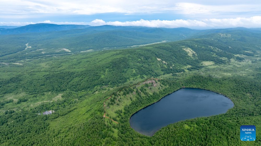 An aerial drone photo taken on June 27, 2026 shows the summer scenery of the Arxan National Forest Park, Hinggan League, north China's Inner Mongolia Autonomous Region. (Xinhua/Bei He)

