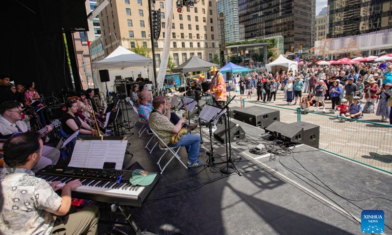 Musicians perform during the Downtown Jazz Weekend at the Vancouver Art Gallery plaza in Vancouver, British Columbia, Canada, on June 27, 2026. As part of the Vancouver International Jazz Festival, the two-day public event features local, national and international artists offering free live jazz performances to the public. The 17-day festival, running until July 5, features over 150 artists and 175 performances across Vancouver, celebrating jazz and diverse music styles. (Photo by Liang Sen/Xinhua)

