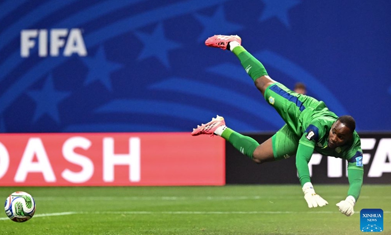 Lionel Mpasi, goalkeeper of the Democratic Republic of the Congo (DRC), jumps to save a ball during the group K match between the Democratic Republic of the Congo and Uzbekistan at the 2026 FIFA World Cup at Atlanta Stadium in Atlanta, the United States, June 27, 2026. (Xinhua/Ju Huanzong)

