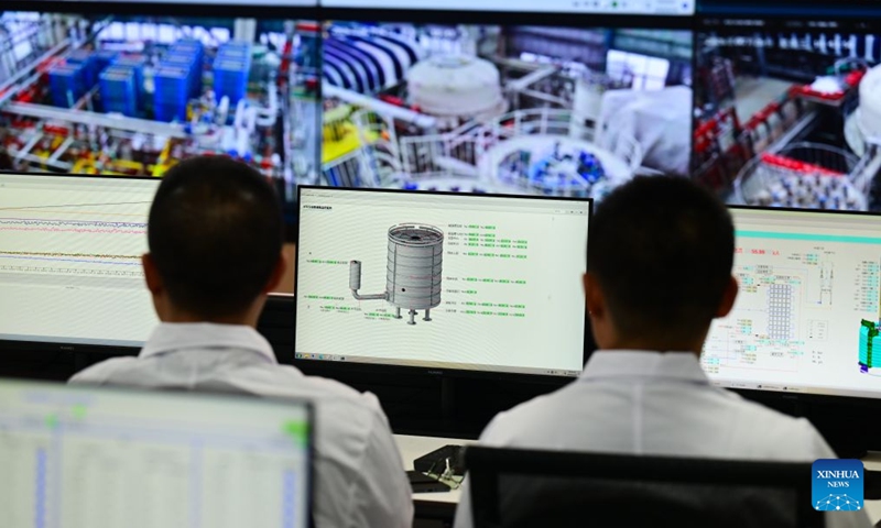 Researchers watch the testing of a high-temperature superconducting central solenoid coil in Hefei, east China's Anhui Province, June 26, 2026. 