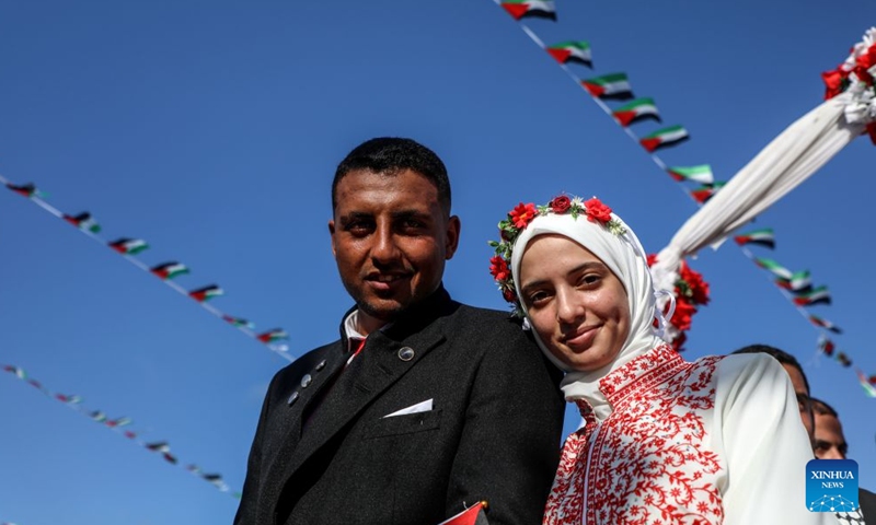 A Palestinian bride and her groom participate in a group wedding in Jabalia refugee camp in the northern Gaza Strip, June 28, 2026. (Photo by Rizek Abdeljawad/Xinhua)


