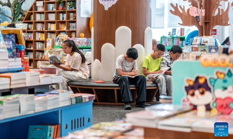 People read at a bookstore in Kunming, southwest China's Yunnan Province, June 28, 2026. Lots of residents enjoy their leisure time immersed in books at bookstores in Kunming over the weekend. Recent years have seen the city actively expand public reading spaces to foster a strong atmosphere for reading culture. (Xinhua/Hu Chao)

