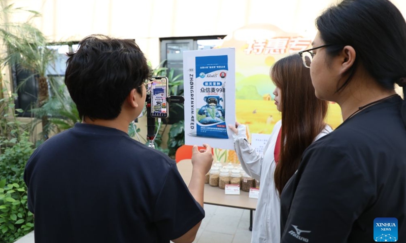 Staff members promote agricultural products via livestream at an industrial park in Cheng'an County of Handan City, north China's Hebei Province, June 26, 2026. (Photo by Liang Jiayuan/Xinhua)