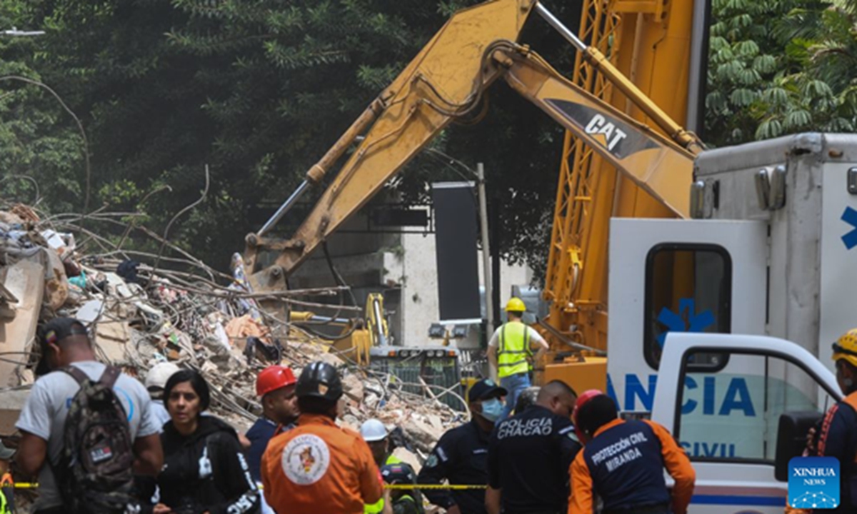 An excavator works on a collapsed building in Chacao, Venezuela, on June 28, 2026. Venezuelan National Assembly President Jorge Rodriguez said Sunday that the death toll from two powerful earthquakes that struck Venezuela Wednesday has risen to 1,450. Photo: Xinhua