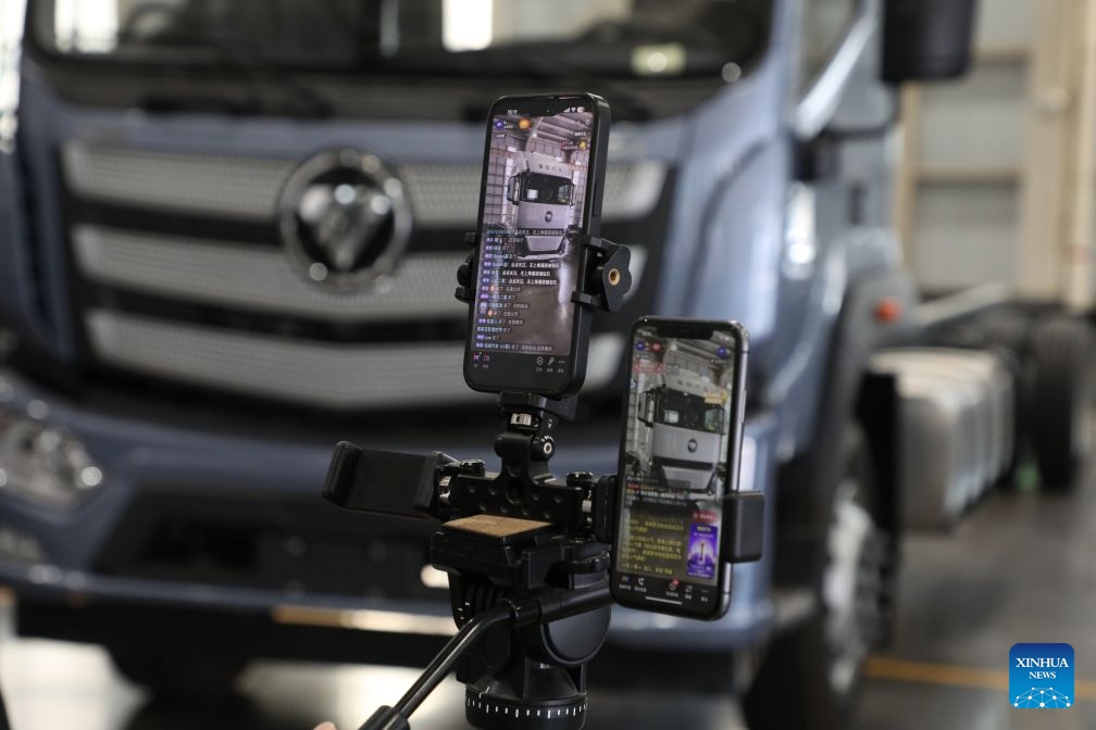 This photo taken on June 26, 2026 shows the screens of mobile phones displaying an ongoing livestream at a specialized truck manufacturing enterprise in Cheng'an County of Handan City, north China's Hebei Province.  (Photo by Liang Jiayuan/Xinhua)