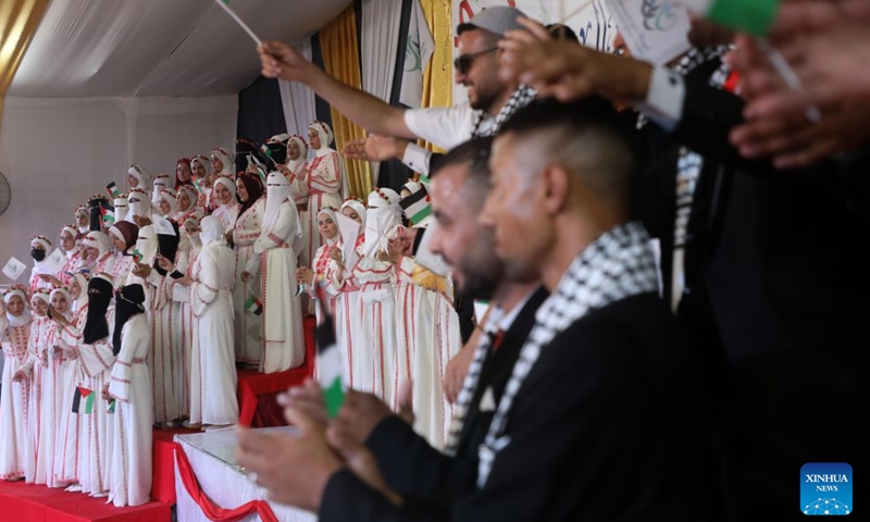 Palestinian brides and grooms participate in a group wedding in Jabalia refugee camp in the northern Gaza Strip, June 28, 2026. (Photo by Rizek Abdeljawad/Xinhua)

