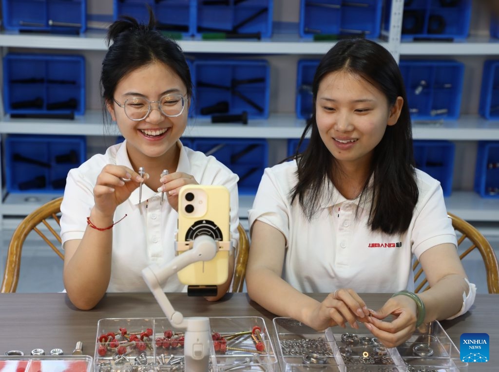 Staff members promote fastener products via livestream at an industrial park in Cheng'an County of Handan City, north China's Hebei Province, June 26, 2026. (Photo by Liang Jiayuan/Xinhua)