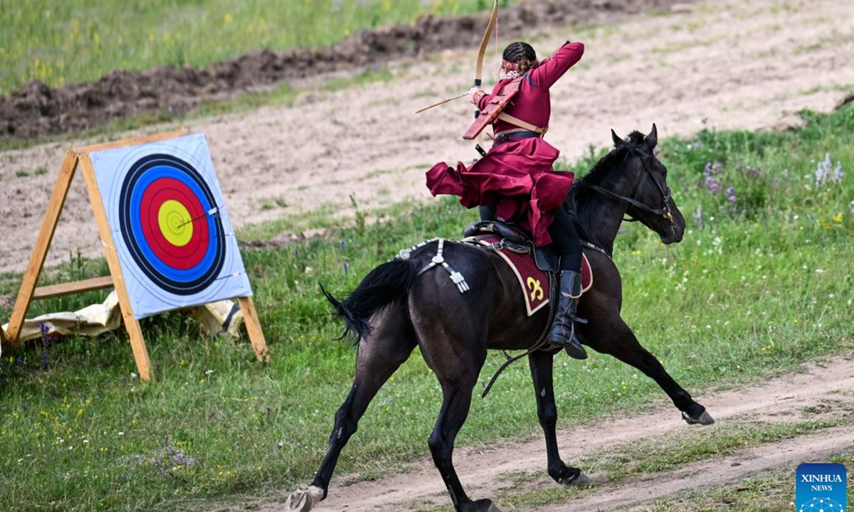 A rider demonstrates horseback archery during a grand ethnic cultural event in Karkara, Almaty Region, Kazakhstan, on June 27, 2026. (Xinhua/Li Renzi)

