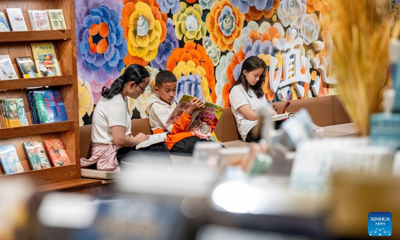 People read at a bookstore in Kunming, southwest China's Yunnan Province, June 28, 2026. Lots of residents enjoy their leisure time immersed in books at bookstores in Kunming over the weekend. Recent years have seen the city actively expand public reading spaces to foster a strong atmosphere for reading culture. (Xinhua/Hu Chao)

