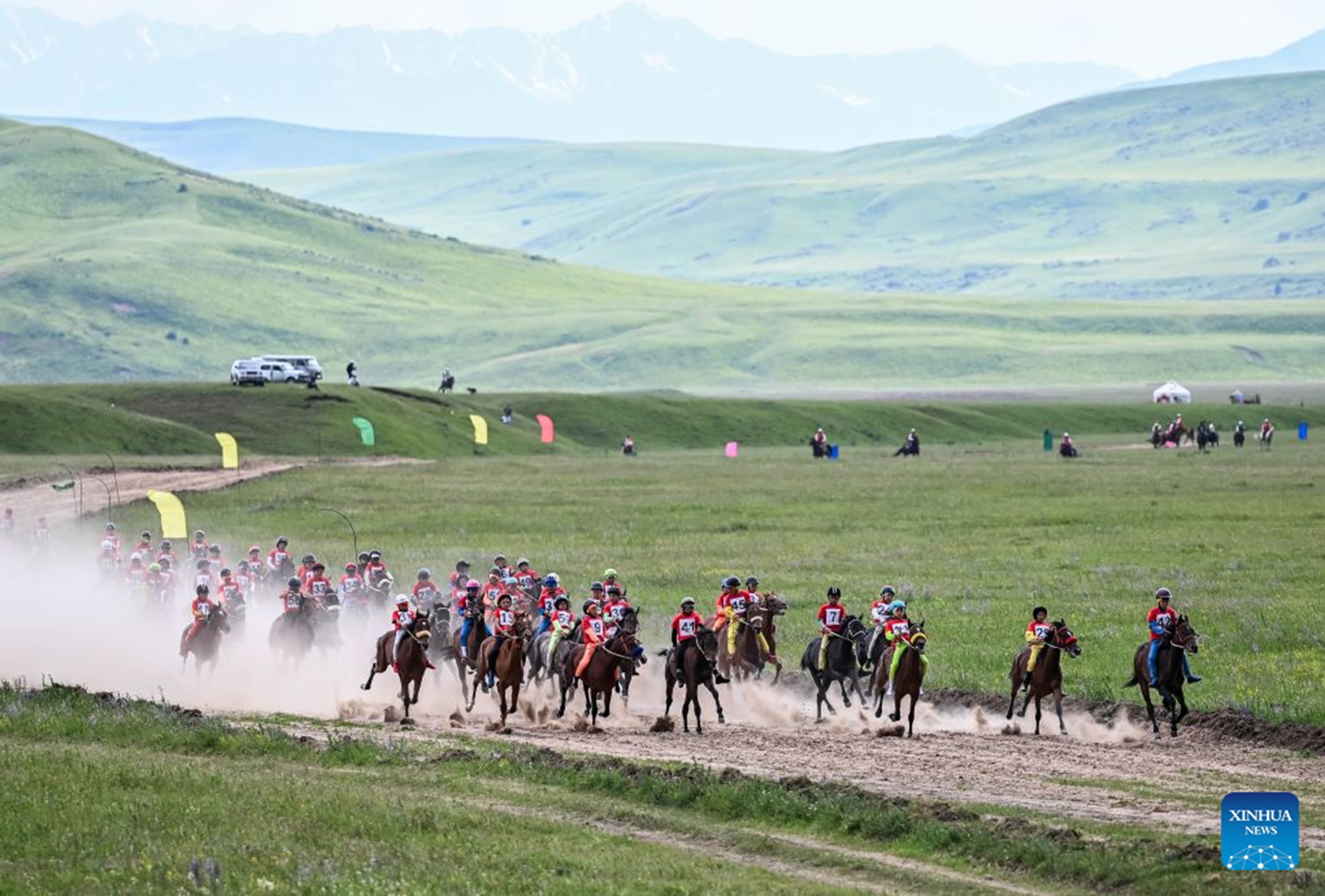 Riders compete during a grand ethnic cultural event in Karkara, Almaty Region, Kazakhstan, on June 27, 2026. (Xinhua/Li Renzi)


