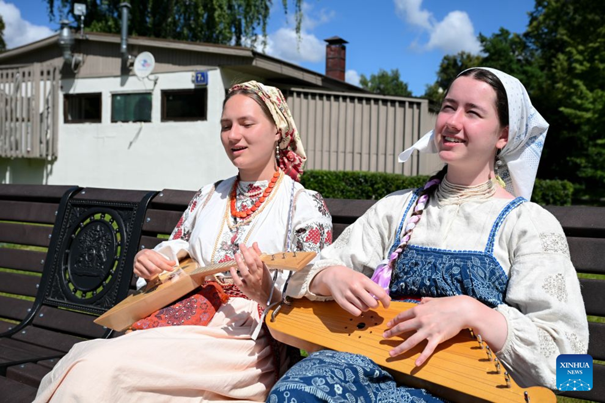 Performers in traditional costumes demonstrate the balalaika and gusli at Ostankino Park in Moscow, Russia, on June 28, 2026. From June 27 to 28, a variety of events were held at Ostankino Park to mark the Sheremetev Festival. (Xinhua/Feng Kaihua)

