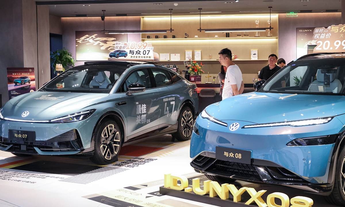 Visitors check out Volkswagen Anhui models during a new energy vehicle trade show in Shanghai on June 20, 2026. Photo: VCG