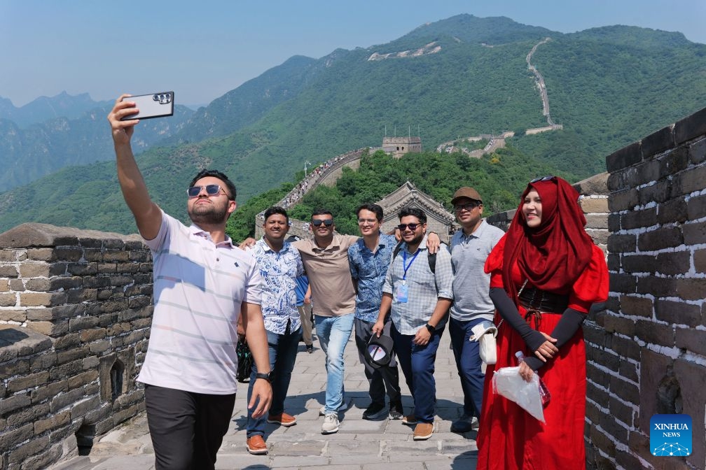 Bangladeshi youths visit the Mutianyu section of the Great Wall in Beijing, capital of China, June 28, 2026. From June 27 to 30, the Academy of Contemporary China and World Studies (ACCWS) organized a tour in Beijing for Bangladeshi youth. (Photo: Xinhua)
