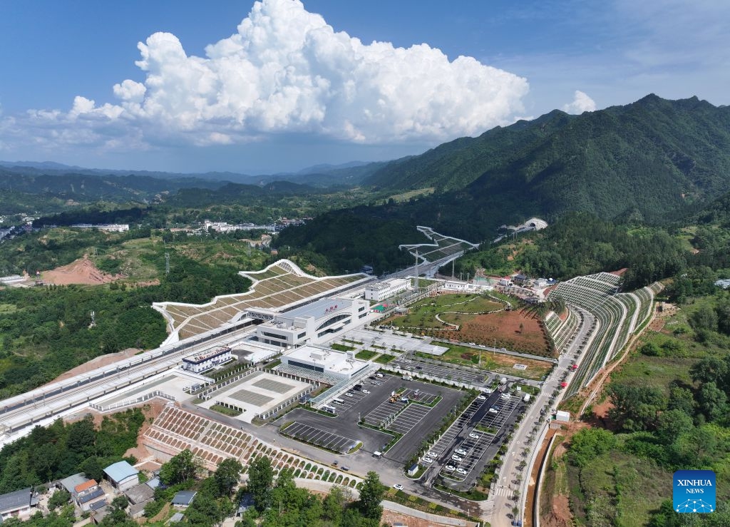 An aerial drone photo taken on June 28, 2026 shows the Shanyang Railway Station in Shangluo City, northwest China's Shaanxi Province. The Xi'an-Shiyan high-speed railway is set to enter operation on Tuesday, cutting the fastest travel time between Xi'an, capital of northwest China's Shaanxi Province, and Wuhan, capital of central China's Hubei Province, to 2 hours and 41 minutes. It connects major tourist attractions including the Qinling Mountains and Wudang Mountain, and its operation is expected to boost local tourism. (Photo: Xinhua)