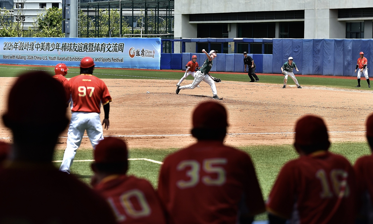 Players watch a match between the Fujian team and the Northeastern State University River Hawks baseball team from Oklahoma, the US, during the Bond with Kuliang: China-US Youth Baseball Exhibition Games and Sports Festival in Pingtan, East China's Fujian Province, on June 30, 2026. Photo: VCG