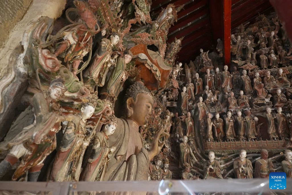 This photo taken on May 19, 2026 shows clay wall sculptures in Lantian County in Xi'an northwest China's Shaanxi Province. The Xi'an-Shiyan high-speed railway is set to enter operation on Tuesday, cutting the fastest travel time between Xi'an, capital of northwest China's Shaanxi Province, and Wuhan, capital of central China's Hubei Province, to 2 hours and 41 minutes. It connects major tourist attractions including the Qinling Mountains and Wudang Mountain, and its operation is expected to boost local tourism. (Photo: Xinhua)